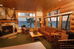 Image of This one bedroom cottage includes a king sized bed and a sleeper sofa in the living room. There is a full kitchen and and a grill for your convenience. The cottage includes a queen size bed and is fully furnished throughout. The deck offers breathtaking views of the lake.