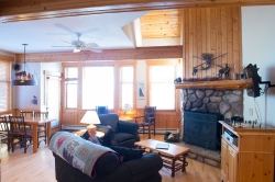 Image of Surrounded by the northwoods, this two bedroom cottage is perfect for a family or a friends weekend. Each bedroom has a queen sized bed. The cottage offers a full kitchen, is fully furnished, and includes a stone fireplace. 